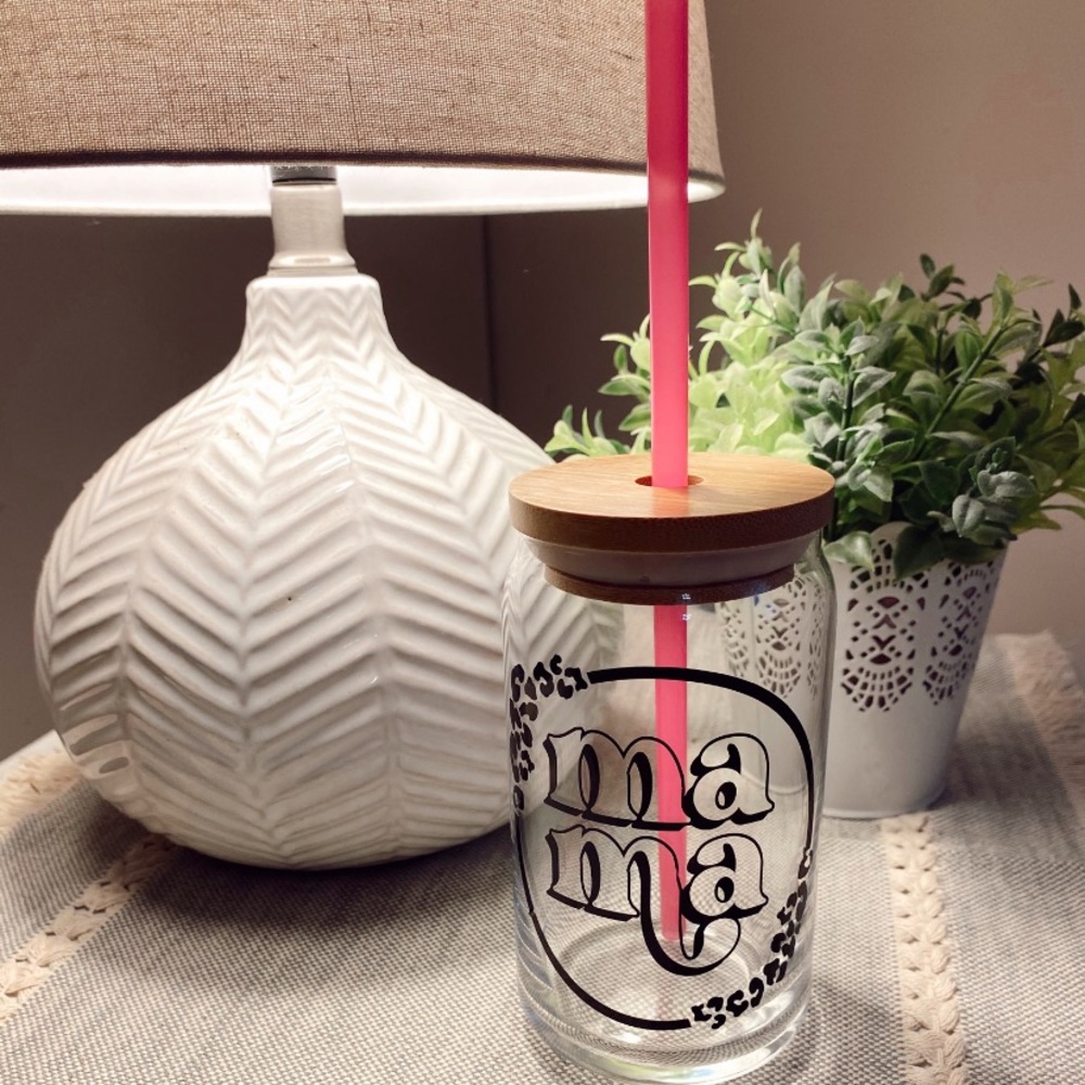 Glass can with bamboo lid and straw